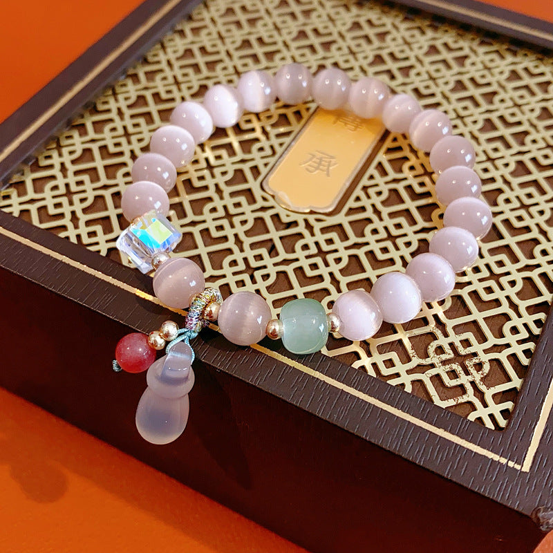 Pastel cat’s-eye and chalcedony beaded bracelet with frosted cat pendant — Moonlit Cat’s Eye Charm Bracelet by Glazenya.
