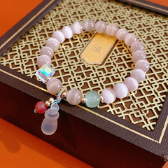 Pastel cat’s-eye and chalcedony beaded bracelet with frosted cat pendant — Moonlit Cat’s Eye Charm Bracelet by Glazenya.
