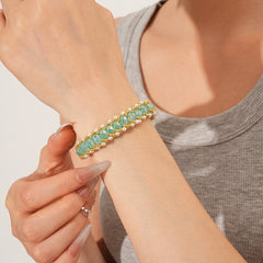 Braided glass-pearl and crystal bracelet with gold extender chain in Coffee Amber/Violet/Jade Green — Braided Pearl Crystal Bracelet.