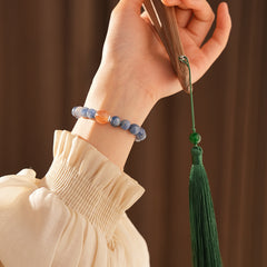Natural blue crystal bracelet featuring a red flower bead centerpiece — Azure Dawn Crystal Bracelet by Glazenya.