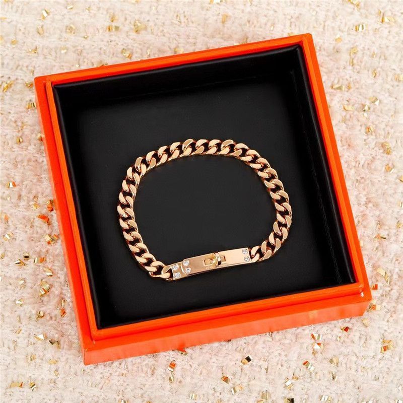 LockChain Minimalist Bracelet in silver, gold, and black metal chain with lock clasp design, displayed on wrist