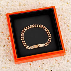 LockChain Minimalist Bracelet in silver, gold, and black metal chain with lock clasp design, displayed on wrist