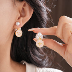 Elegant double pearl stud earrings with bee and emblem coin charms — Bee & Emblem Double Pearl Studs.