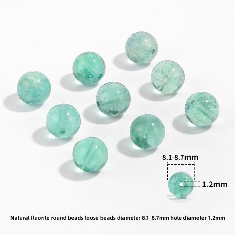 Watery mint-green fluorite round beads with translucent swirls — Mint Spring.