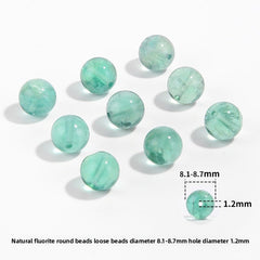 Watery mint-green fluorite round beads with translucent swirls — Mint Spring.