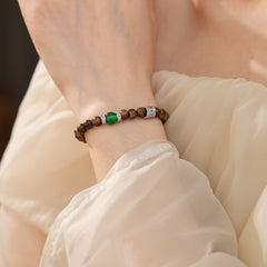 Natural agarwood beaded bracelet with green agate centerpiece and pavé spacers — Verdant Agarwood Bracelet by Glazenya.