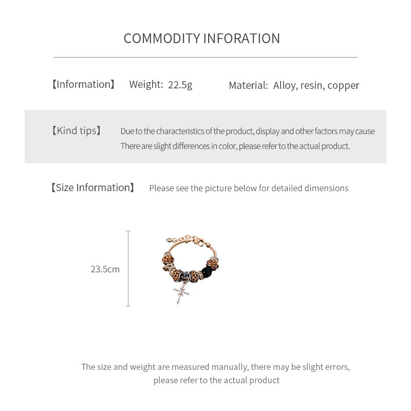 Leopard Cross Luxe Bracelet with leopard-patterned beads, zircon accents, black 8-ball bead, and cross pendant on gold chain