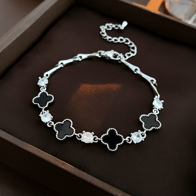 Red enamel clover bracelet with zircon accents and gold tone chain – Glazenya