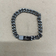 LockChain Minimalist Bracelet in silver, gold, and black metal chain with lock clasp design, displayed on wrist