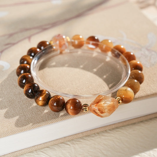 Sunset Harmony Crystal Bangle with yellow crystal and tiger-eye beads, gold-tone spacers, and a clear ring core.