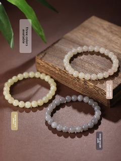 Three Hetian (nephrite) jade bracelets in gradient tones of Yan Purple, Qiemu Yellow, and Lotus Pink — Trinity Harmony Hetian Jade Bead Bracelets.