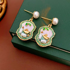 Pearl stud drop earrings with lilac and green enamel cameo and gold accents — Verdant Cameo Pearl Enamel Drops.