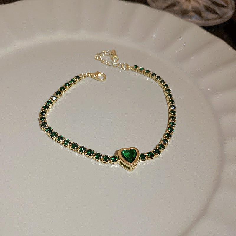 Gold-plated bracelet collection with pearls, cat’s eye stones, and floral motifs