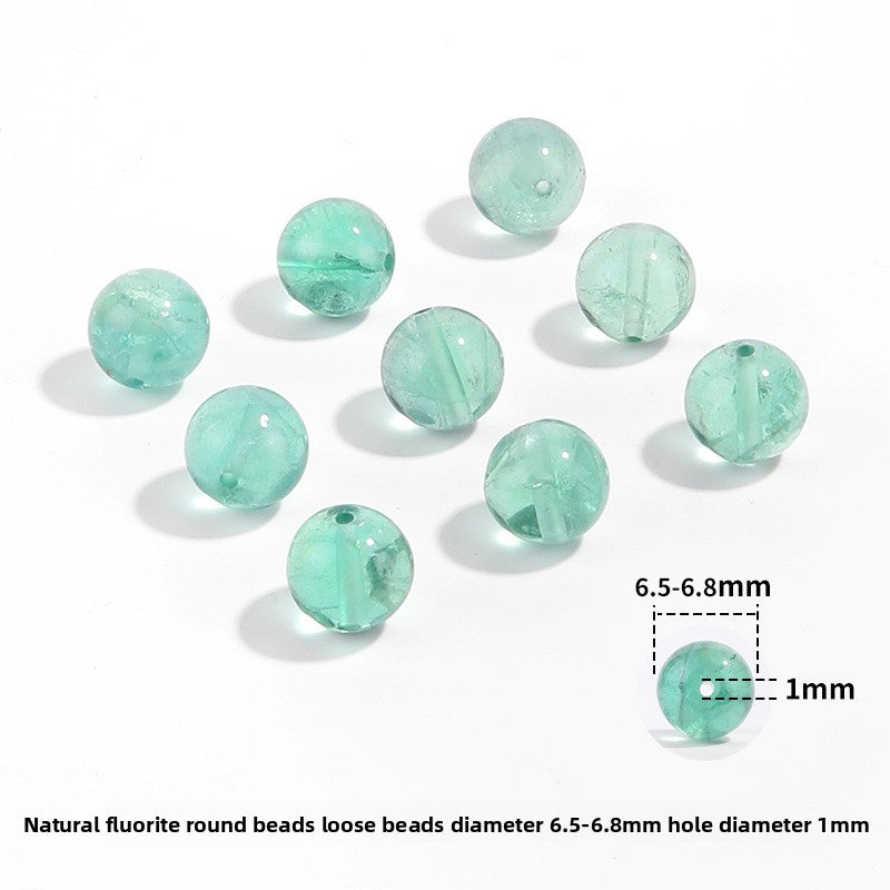 Watery mint-green fluorite round beads with translucent swirls — Mint Spring.