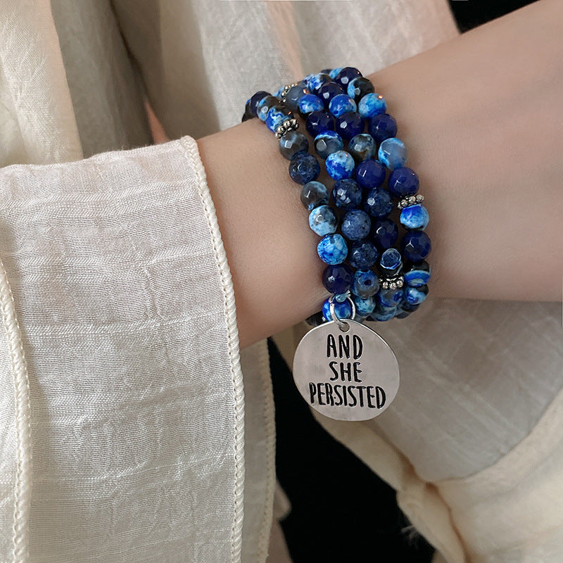 Multi-wrap blue agate bracelet with “AND SHE PERSISTED” charm — Ocean Resolve Bracelet by Glazenya.