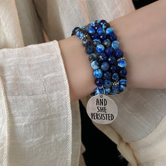 Multi-wrap blue agate bracelet with “AND SHE PERSISTED” charm — Ocean Resolve Bracelet by Glazenya.
