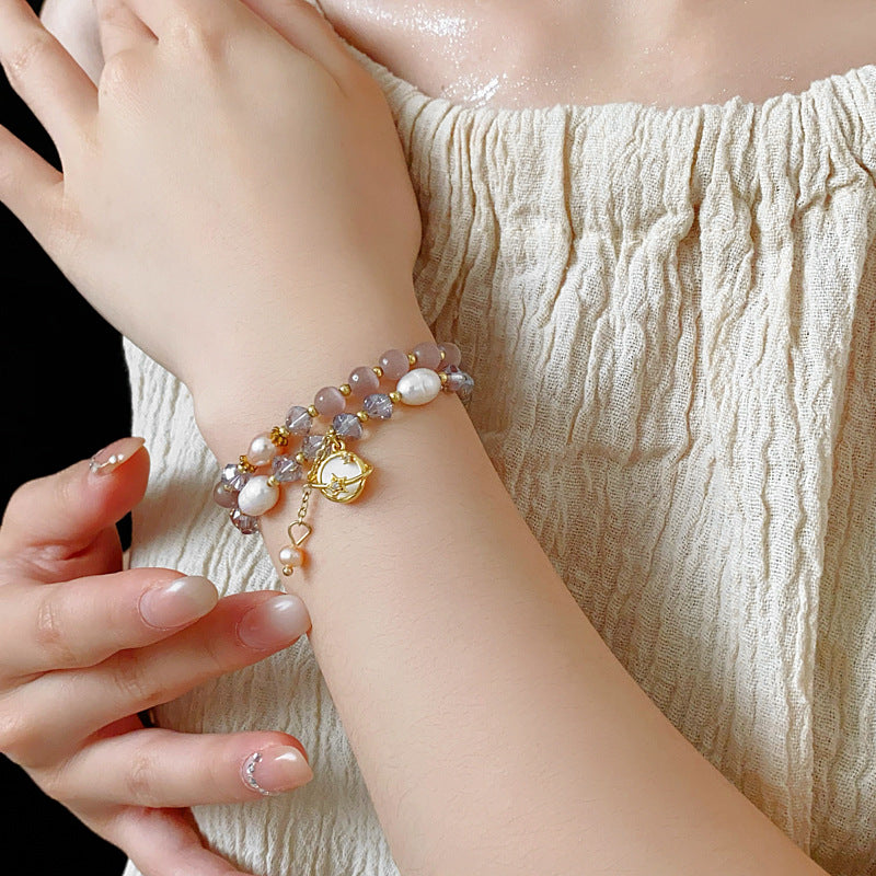 Celestial Cat’s Eye Bracelet double strand with cat’s-eye stones, freshwater pearls, crystal beads and gold planet charm