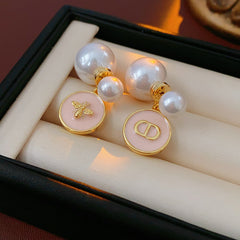 Elegant double pearl stud earrings with bee and emblem coin charms — Bee & Emblem Double Pearl Studs.