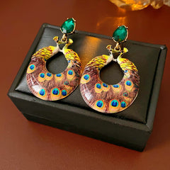 Statement earrings with peacock feather hoop design and emerald stud – Peacock Glory Statement Earrings.