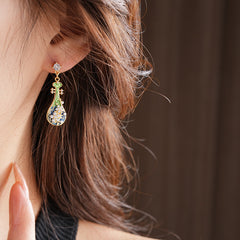 Gold-tone filigree drop earrings with green and blue enamel lute motifs, accented by zircons and tiny pearls — Verdant Lute Filigree Drops.