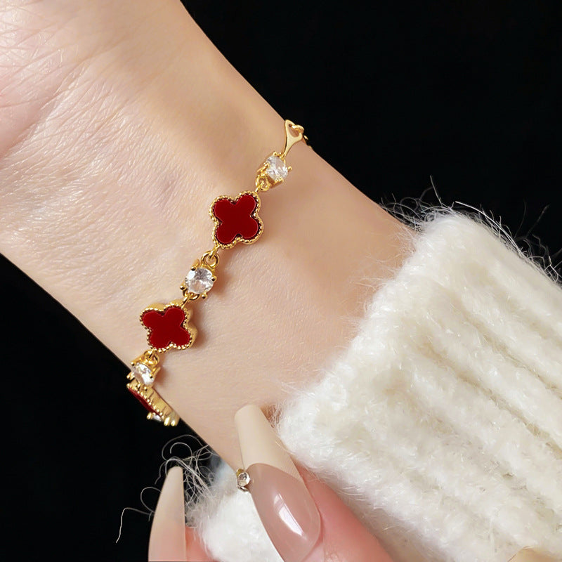 Red enamel clover bracelet with zircon accents and gold tone chain – Glazenya
