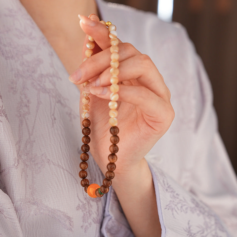 Dual-strand natural stone bracelet with amber centerpiece and shell beads in warm brown and beige tones – Glazenya light luxury jewelry