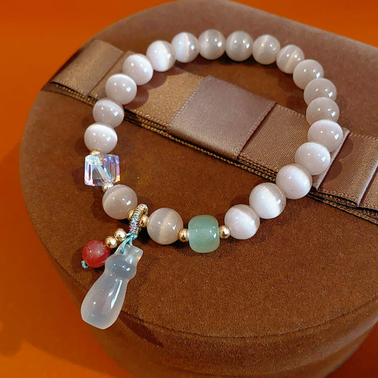 Pastel cat’s-eye and chalcedony beaded bracelet with frosted cat pendant — Moonlit Cat’s Eye Charm Bracelet by Glazenya.