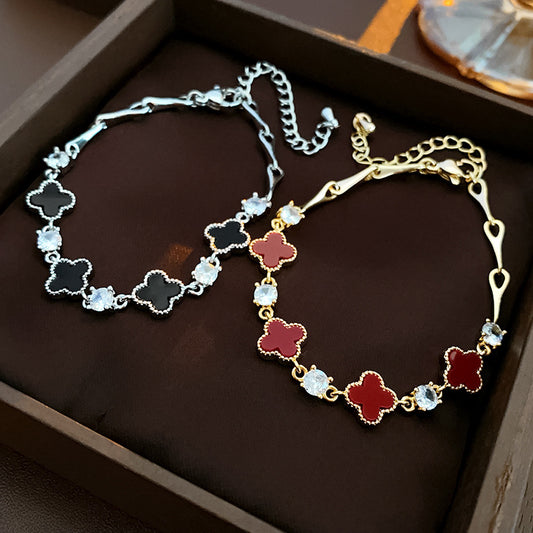 Red enamel clover bracelet with zircon accents and gold tone chain – Glazenya