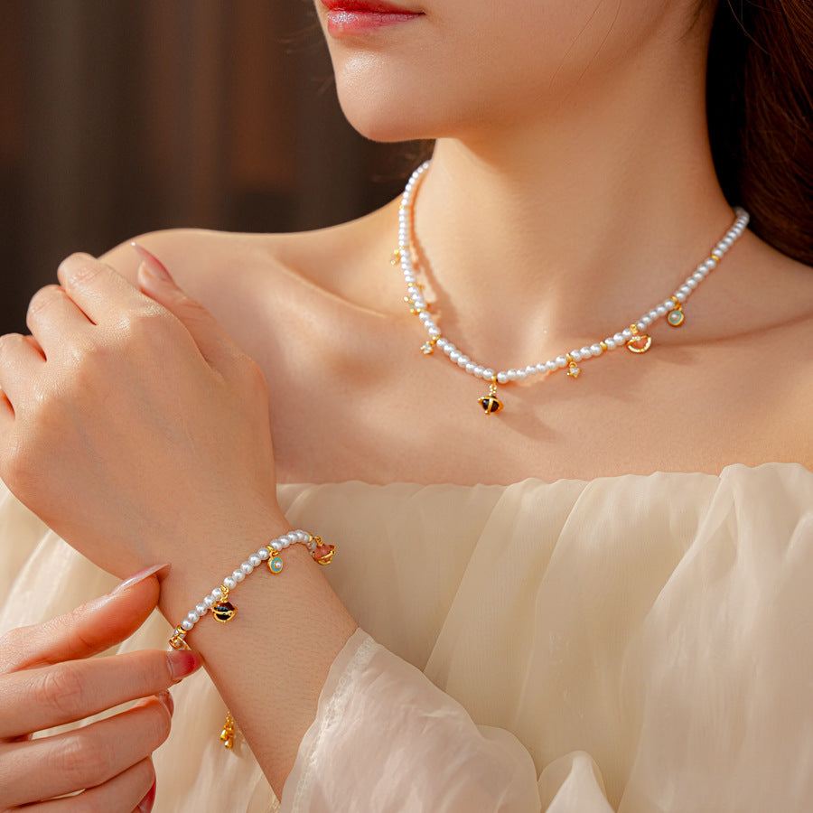Fleur de Pearl Luxe Set with pearl necklace and matching zircon-accented bracelet, elegant and romantic