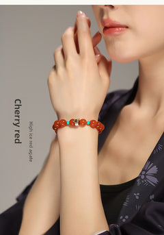 Collectible-grade Hetian jade bracelet with high-ice red agate centerpiece and turquoise accents — Crimson Serenity Hetian Jade Bracelet.