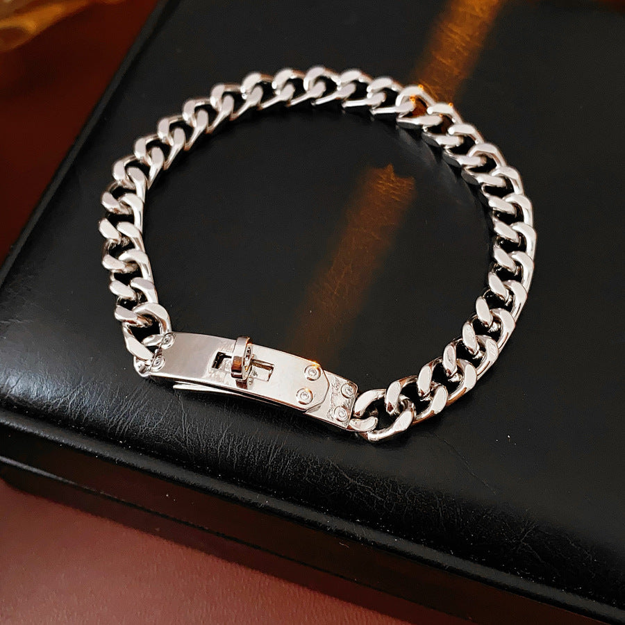 LockChain Minimalist Bracelet in silver, gold, and black metal chain with lock clasp design, displayed on wrist