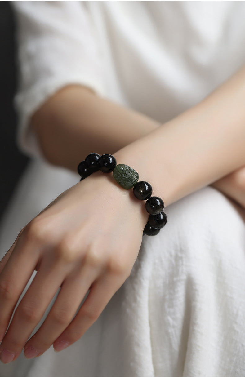 Serene Aegis – Obsidian & Hetian Jade Birth Buddha