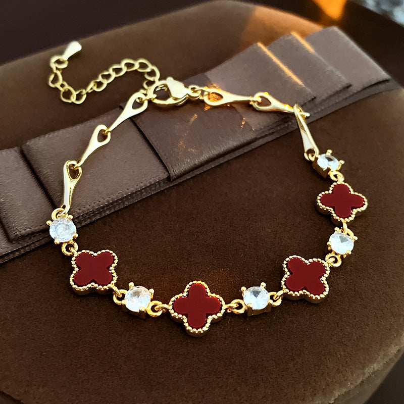 Red enamel clover bracelet with zircon accents and gold tone chain – Glazenya