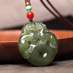 Hand-carved Hetian (nephrite) jade Pi Xiu pendant in glossy celadon green — Fortune Guardian Hetian Jade Pendant.