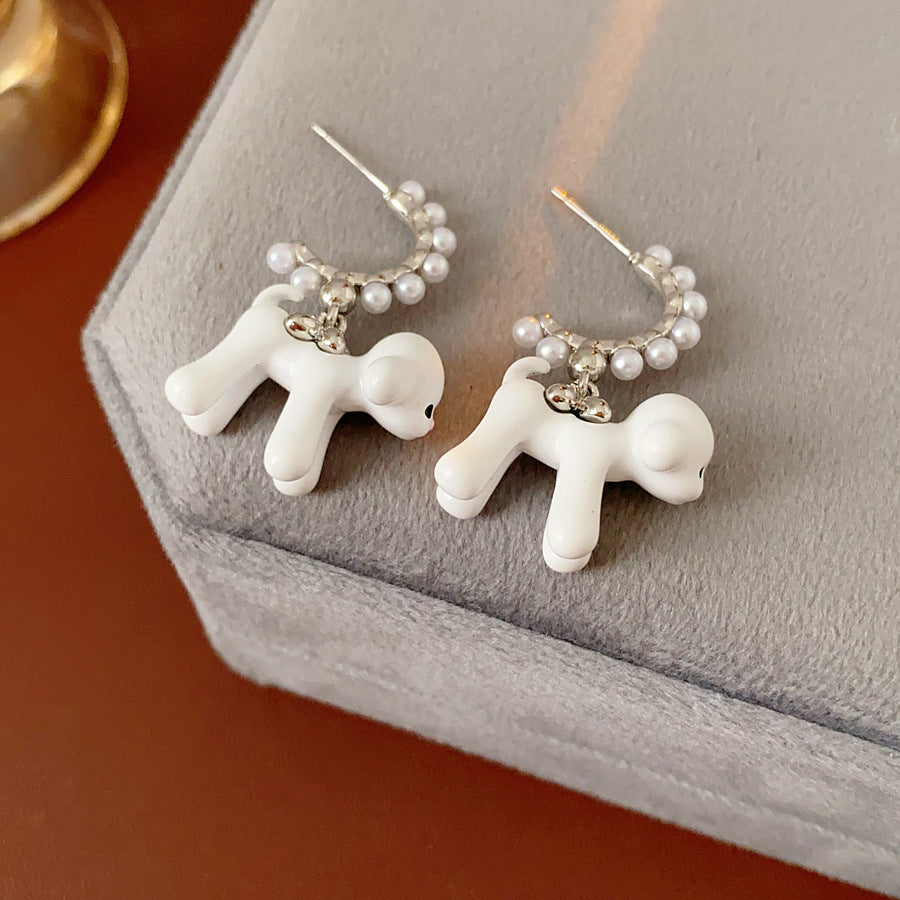 Pearl-adorned hoop earrings with dangling puppy charms in white and coffee — Pearl Pup Charm Hoops.