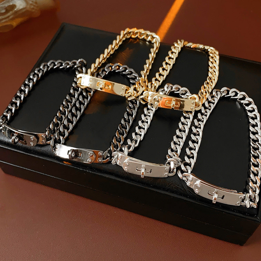 LockChain Minimalist Bracelet in silver, gold, and black metal chain with lock clasp design, displayed on wrist