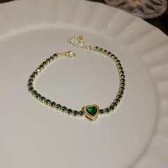Gold-plated bracelet with emerald crystal centerpiece and zircon accents