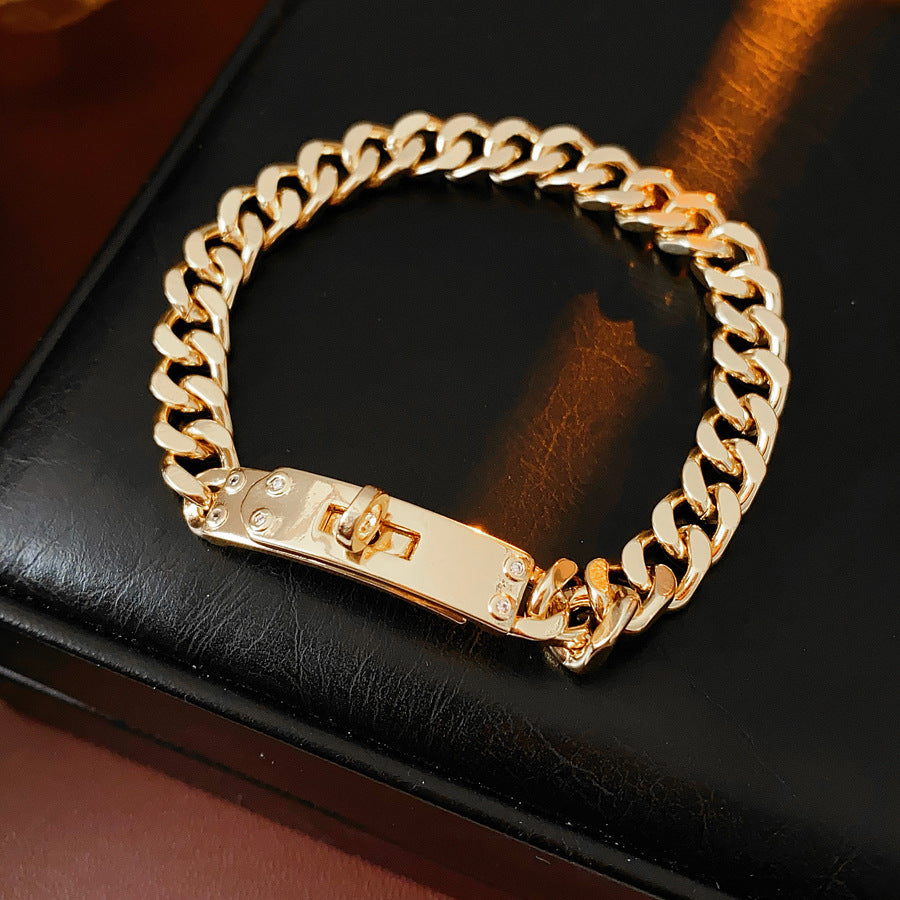 LockChain Minimalist Bracelet in silver, gold, and black metal chain with lock clasp design, displayed on wrist