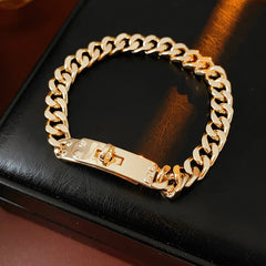LockChain Minimalist Bracelet in silver, gold, and black metal chain with lock clasp design, displayed on wrist