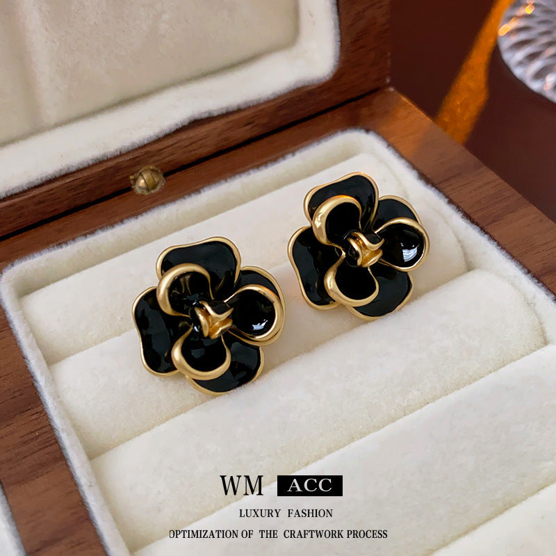 Camellia & Bow Earring Collection with black camellia, bow, pearl, and geometric designs – chic light luxury retro jewelry
