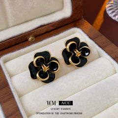 Camellia & Bow Earring Collection with black camellia, bow, pearl, and geometric designs – chic light luxury retro jewelry
