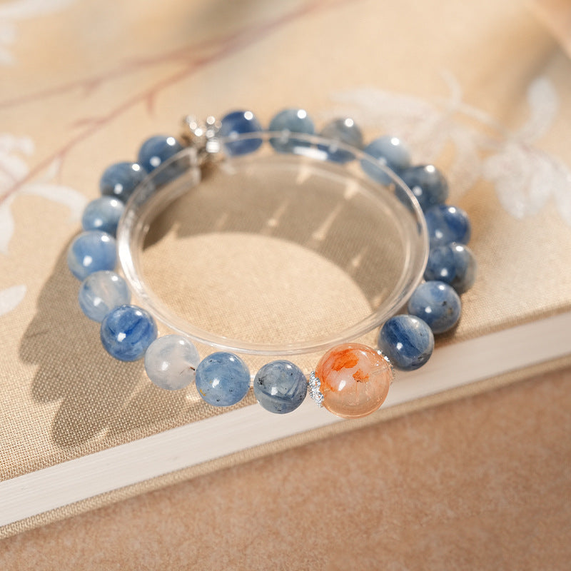 Natural blue crystal bracelet featuring a red flower bead centerpiece — Azure Dawn Crystal Bracelet by Glazenya.