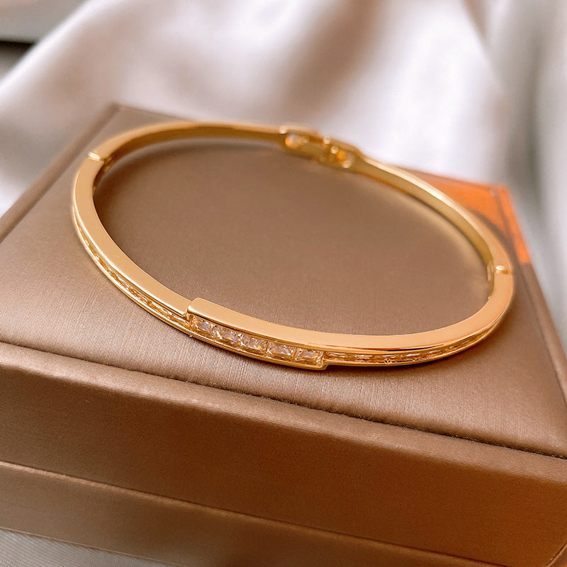 Linea Crystal Channel Bangle in gold tone with channel-set crystals – Glazenya
