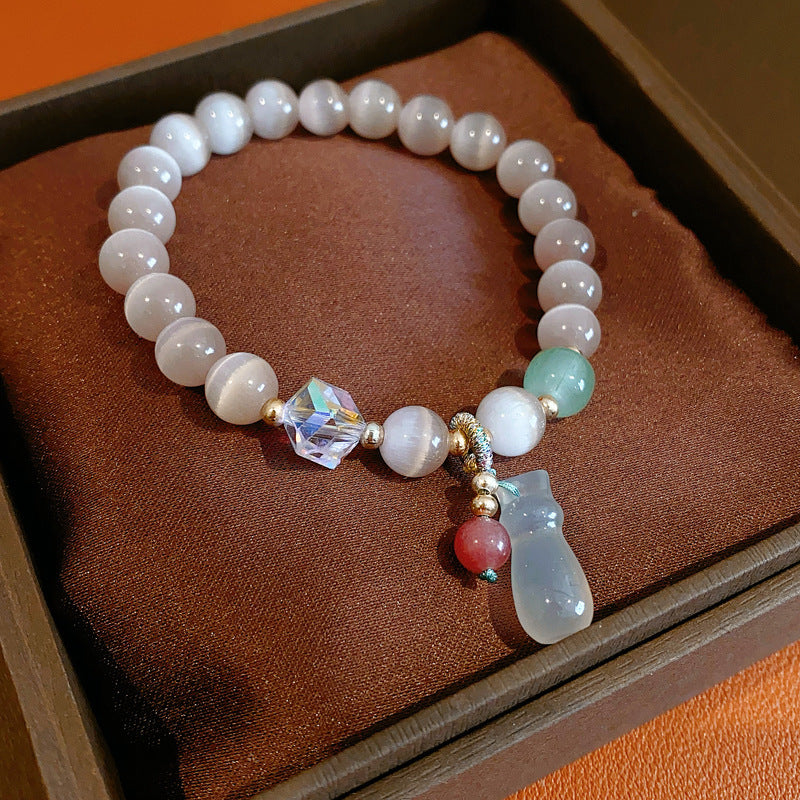 Pastel cat’s-eye and chalcedony beaded bracelet with frosted cat pendant — Moonlit Cat’s Eye Charm Bracelet by Glazenya.