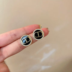 Camellia & Bow Earring Collection with black camellia, bow, pearl, and geometric designs – chic light luxury retro jewelry

