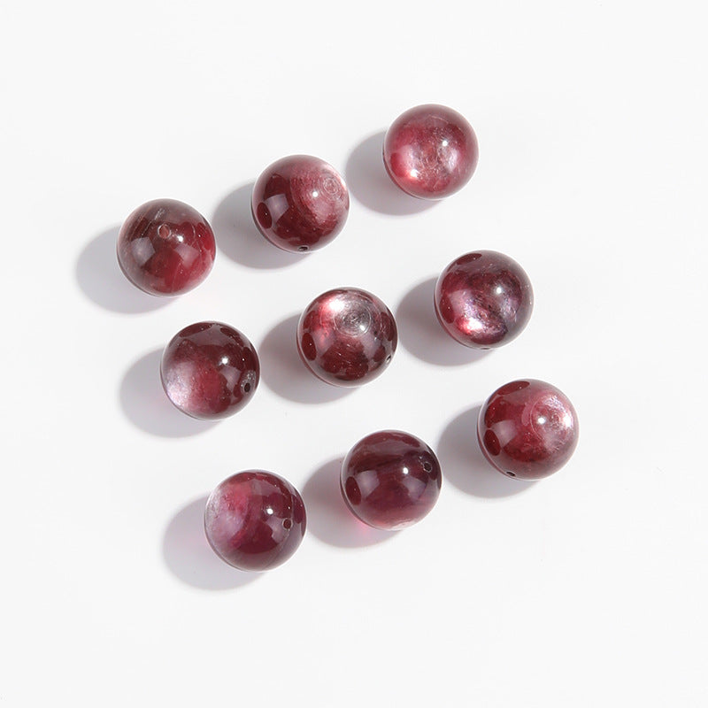 Lepidolite-in-Quartz crystal round beads with berry-pink striations, assorted 8–15 mm.