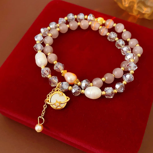 Celestial Cat’s Eye Bracelet double strand with cat’s-eye stones, freshwater pearls, crystal beads and gold planet charm