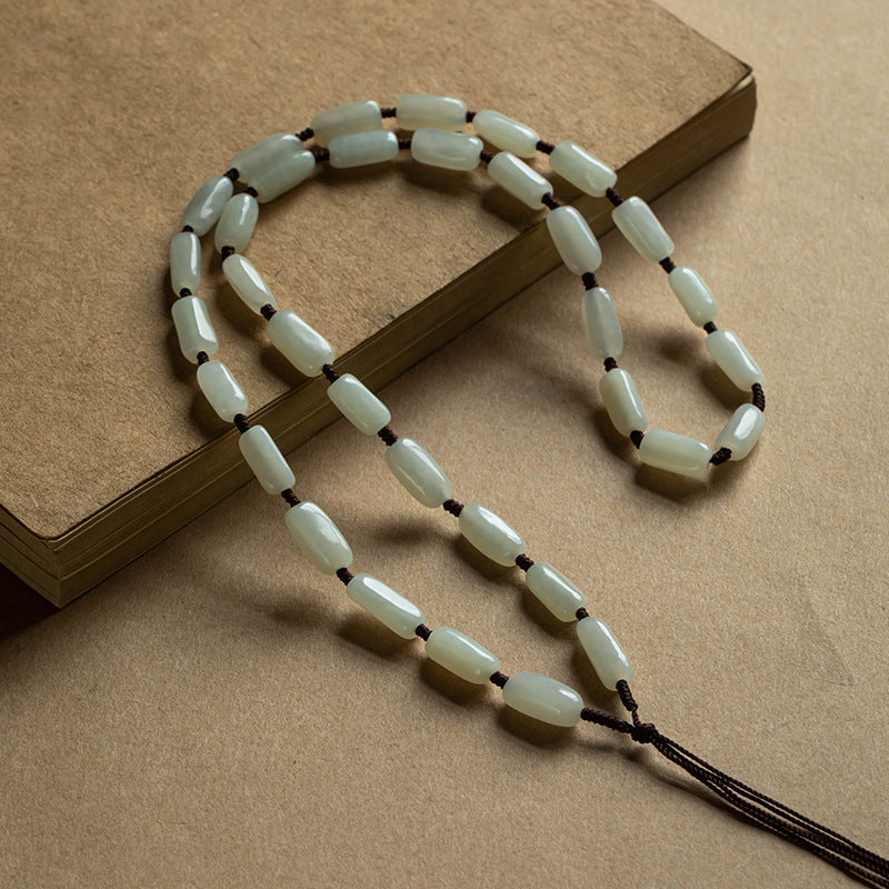 Handcrafted pendant cords wrapped with natural Hetian jade tube beads in light and dark brown — Snowglow Hetian Jade Pendant Cord.