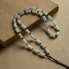 Handcrafted pendant cords wrapped with natural Hetian jade tube beads in light and dark brown — Snowglow Hetian Jade Pendant Cord.