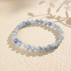 Blue crystal beaded bracelet with gold-tone spacers, shown in 6 mm and 8 mm options — Indigo Mist Crystal Bracelet by Glazenya.